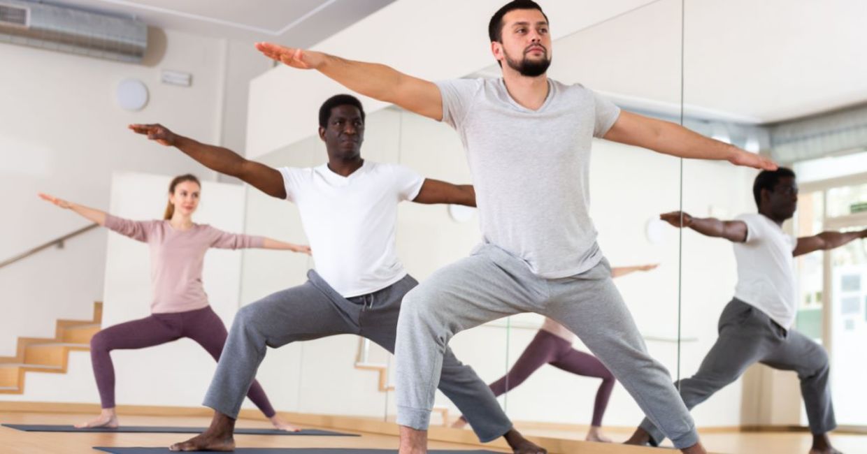 Men performing the Warrior II yoga pose.