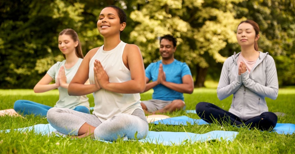 Meditating in a park.
