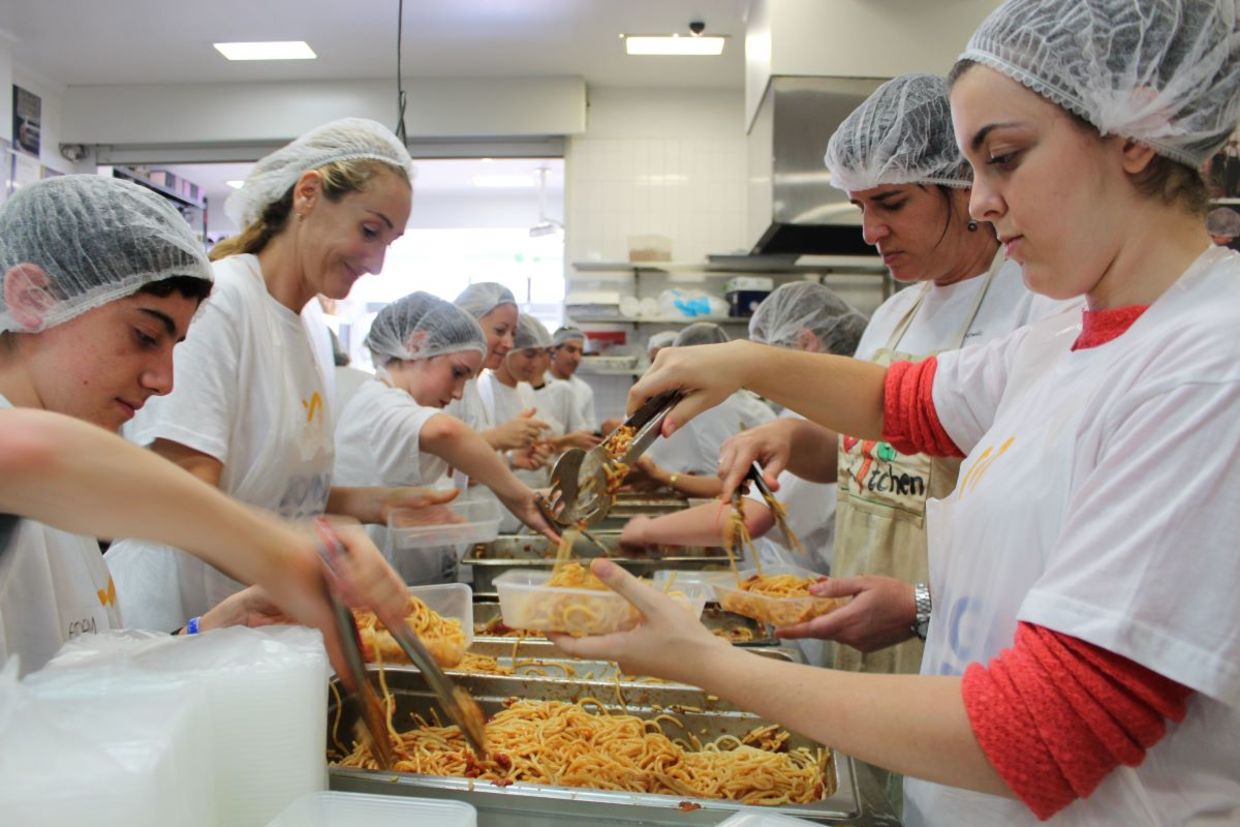 Cooking food to feed the hungry.