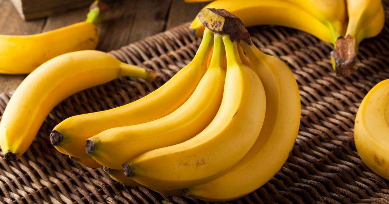 A  bunch of organic yellow bananas.