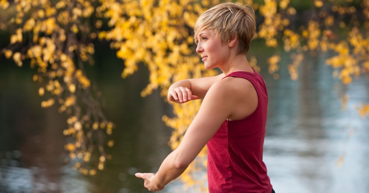 Practicing tai chi near the water.