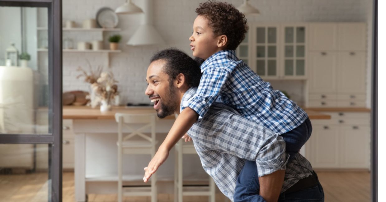 Dad hugging his disabled son.