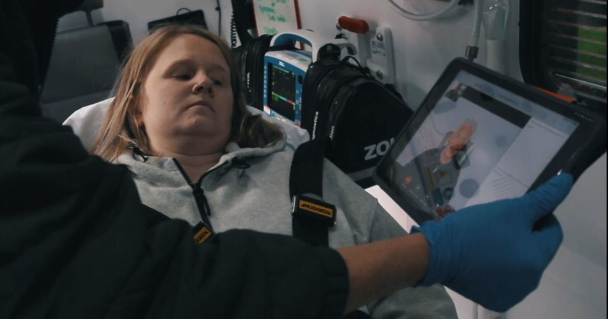 Using a sign language app in an ambulance.