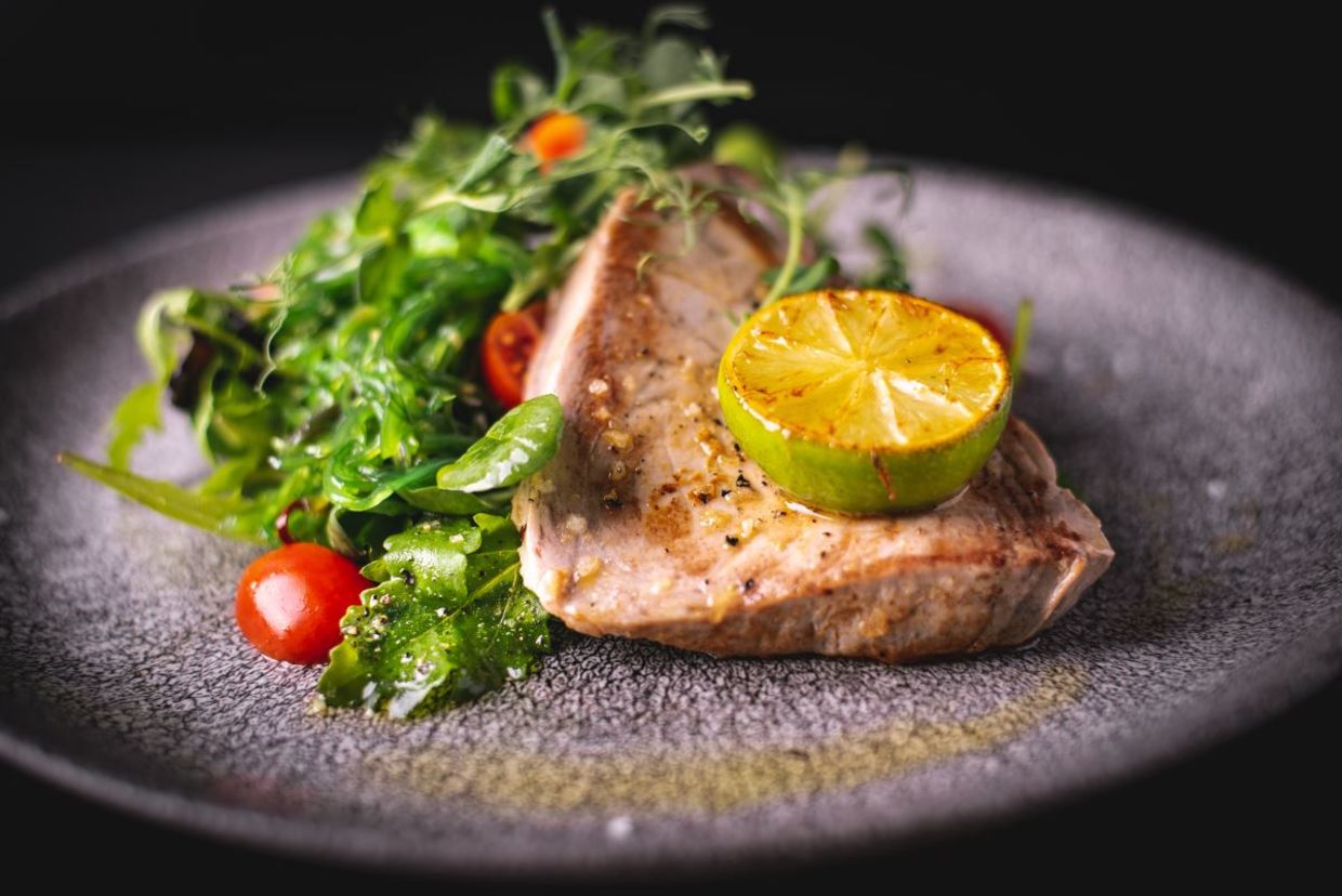 Grilled tuna steak with salad.