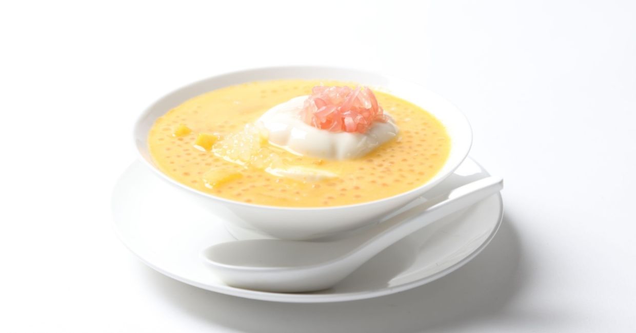 Enjoy cold mango soup.