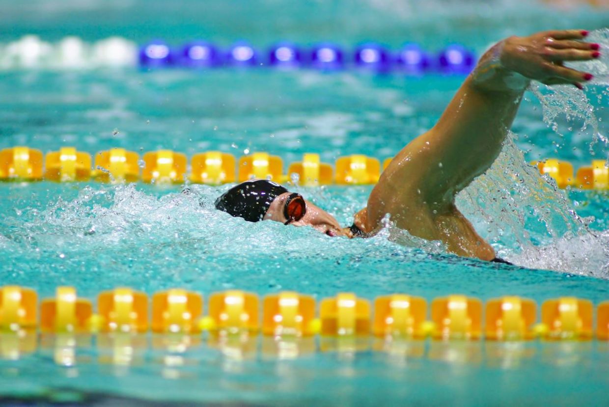 Olympic swimmer competing.