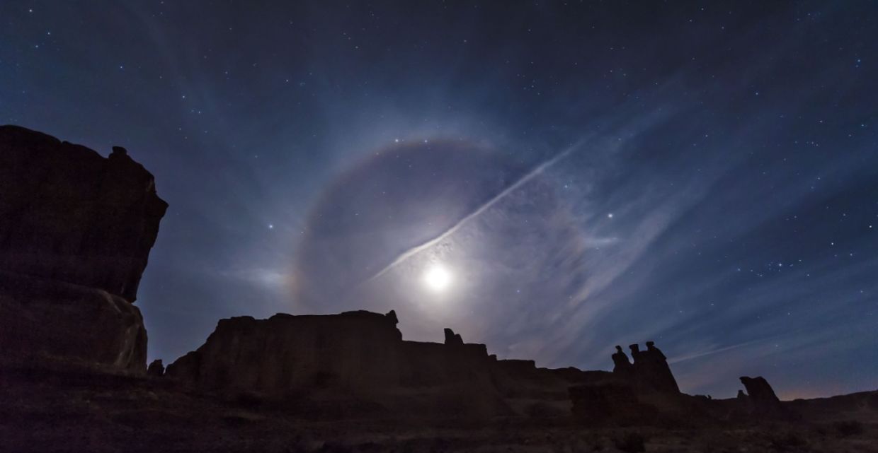 A moon halo over Arches National Park.
