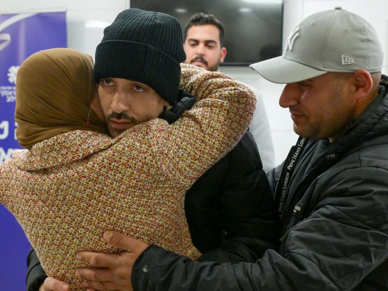 Hisham al-Sayed reunites with loved ones.