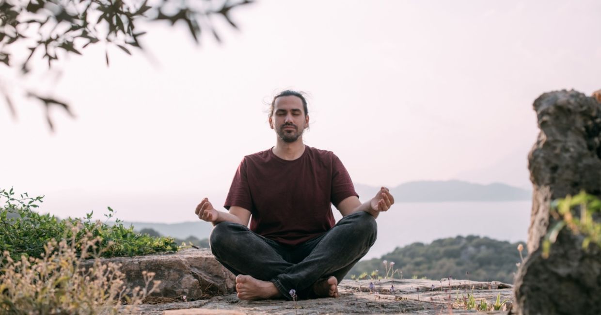 Man meditating in nature.