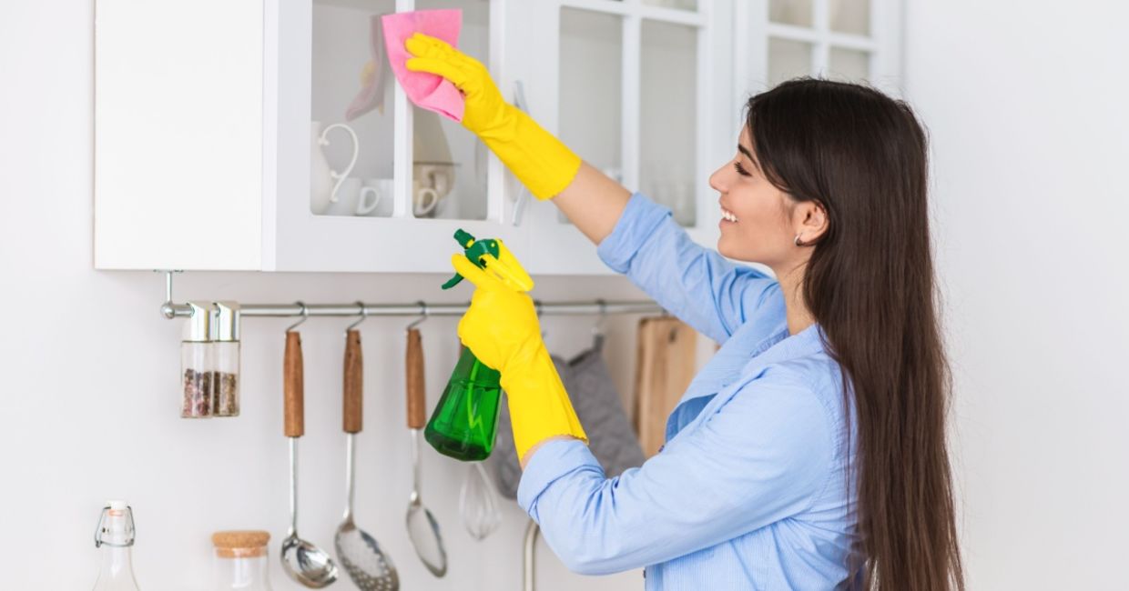 Woman spring cleaning her home.