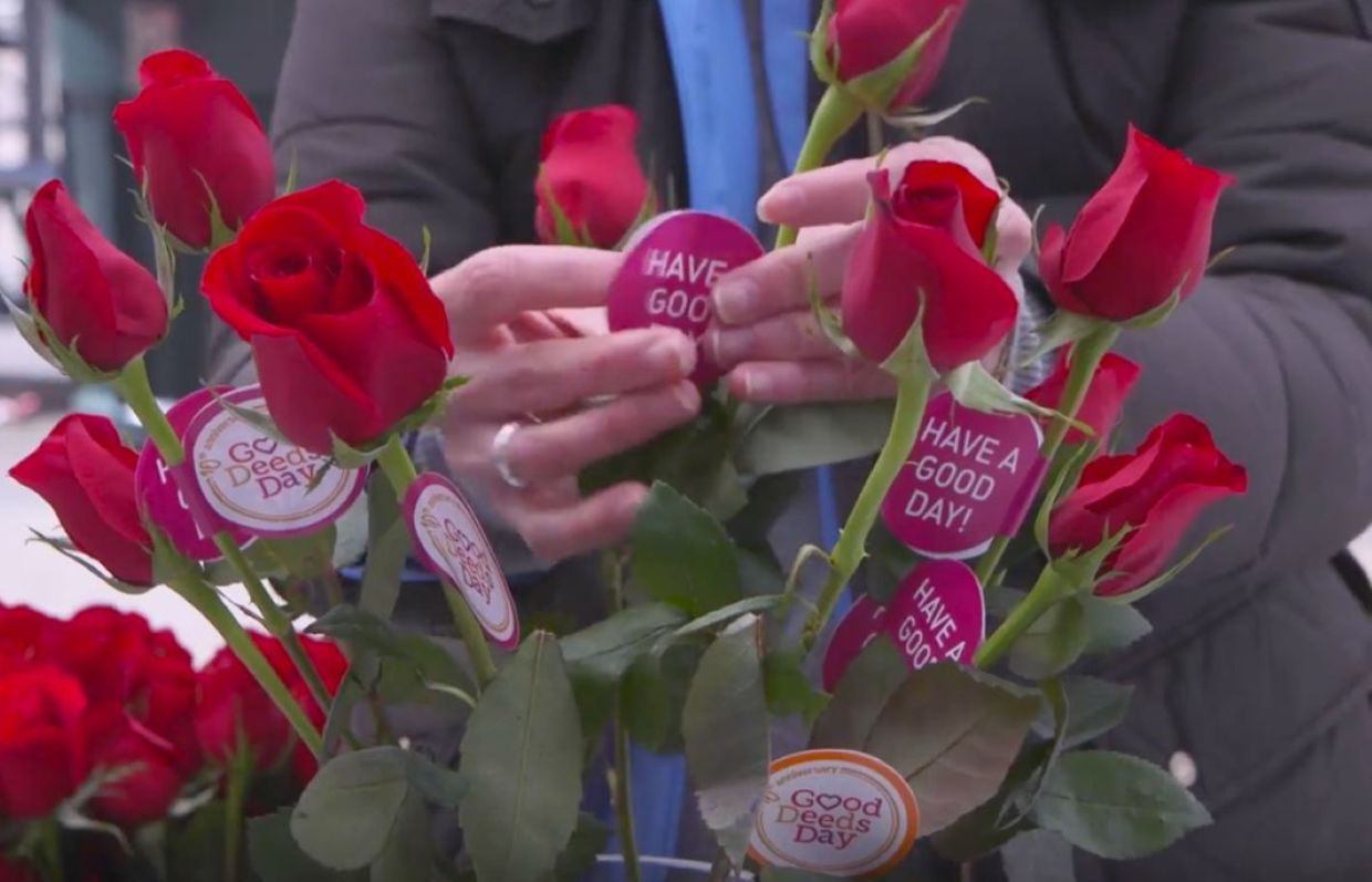 Giving out flowers on Good Deeds Day.