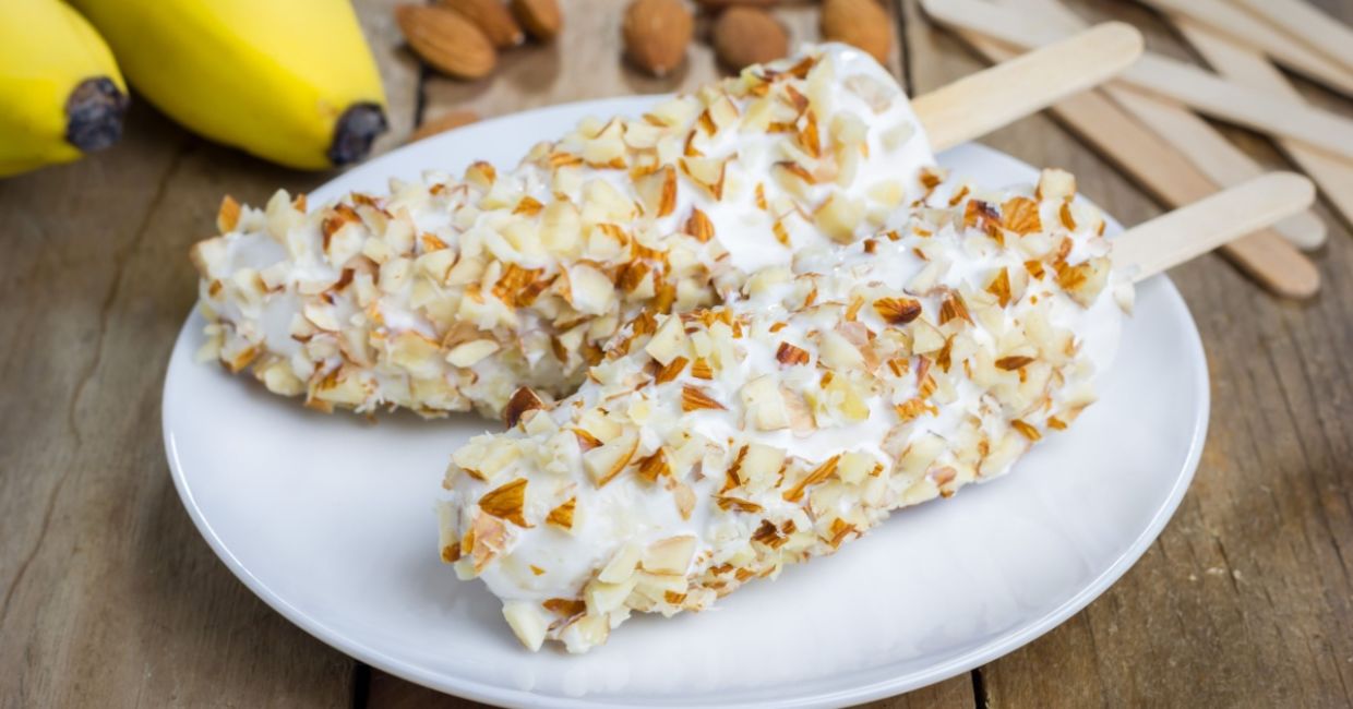 Frozen bananas coated with yogurt and almonds are a healthier choice.
