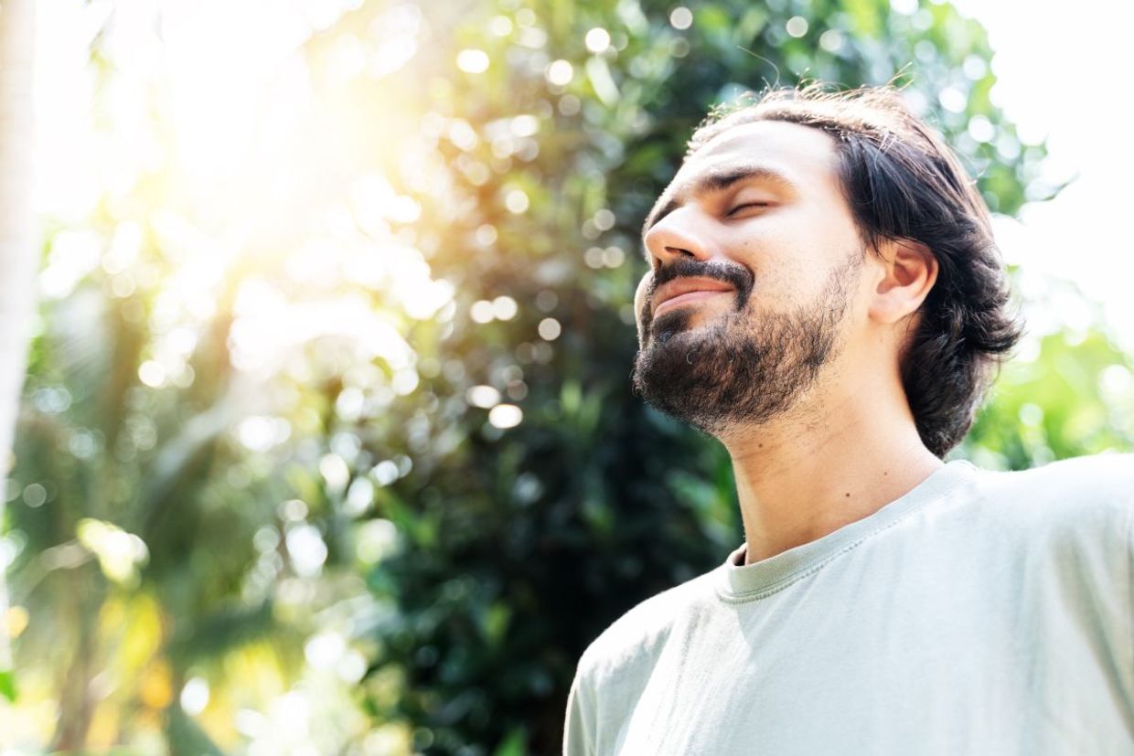 A man taking a meditative walk.