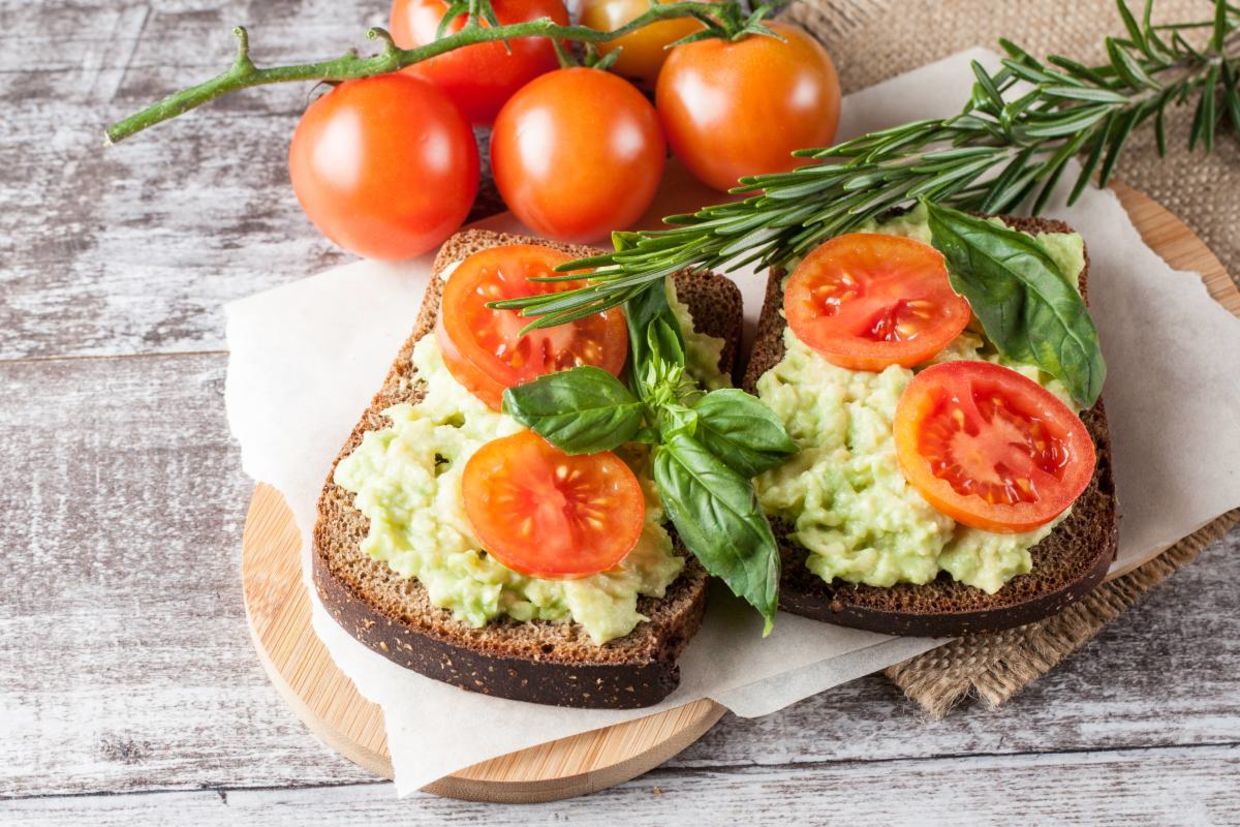 Avocado toast with tomatoes.