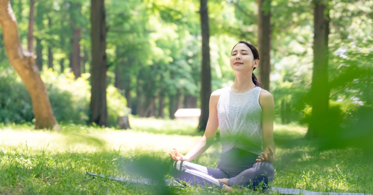 Woman meditating in nature.