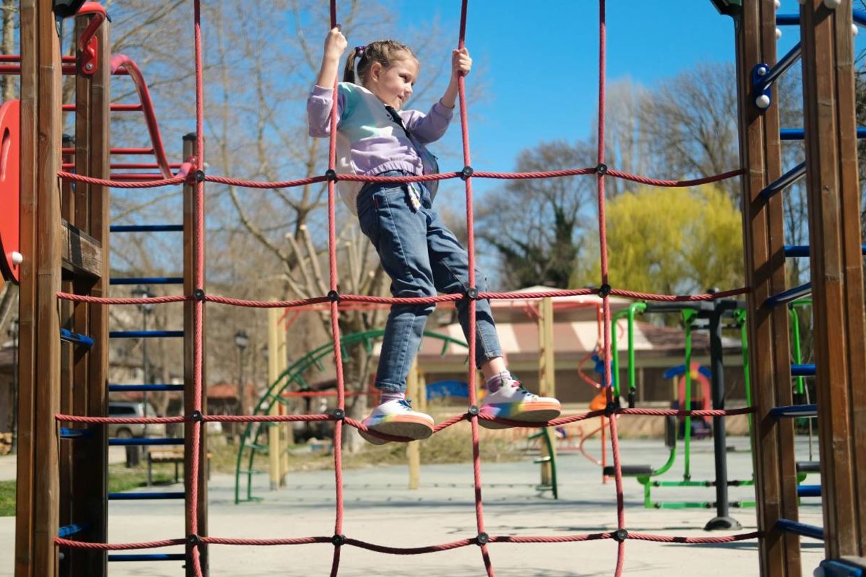 A child playing in an urban park.