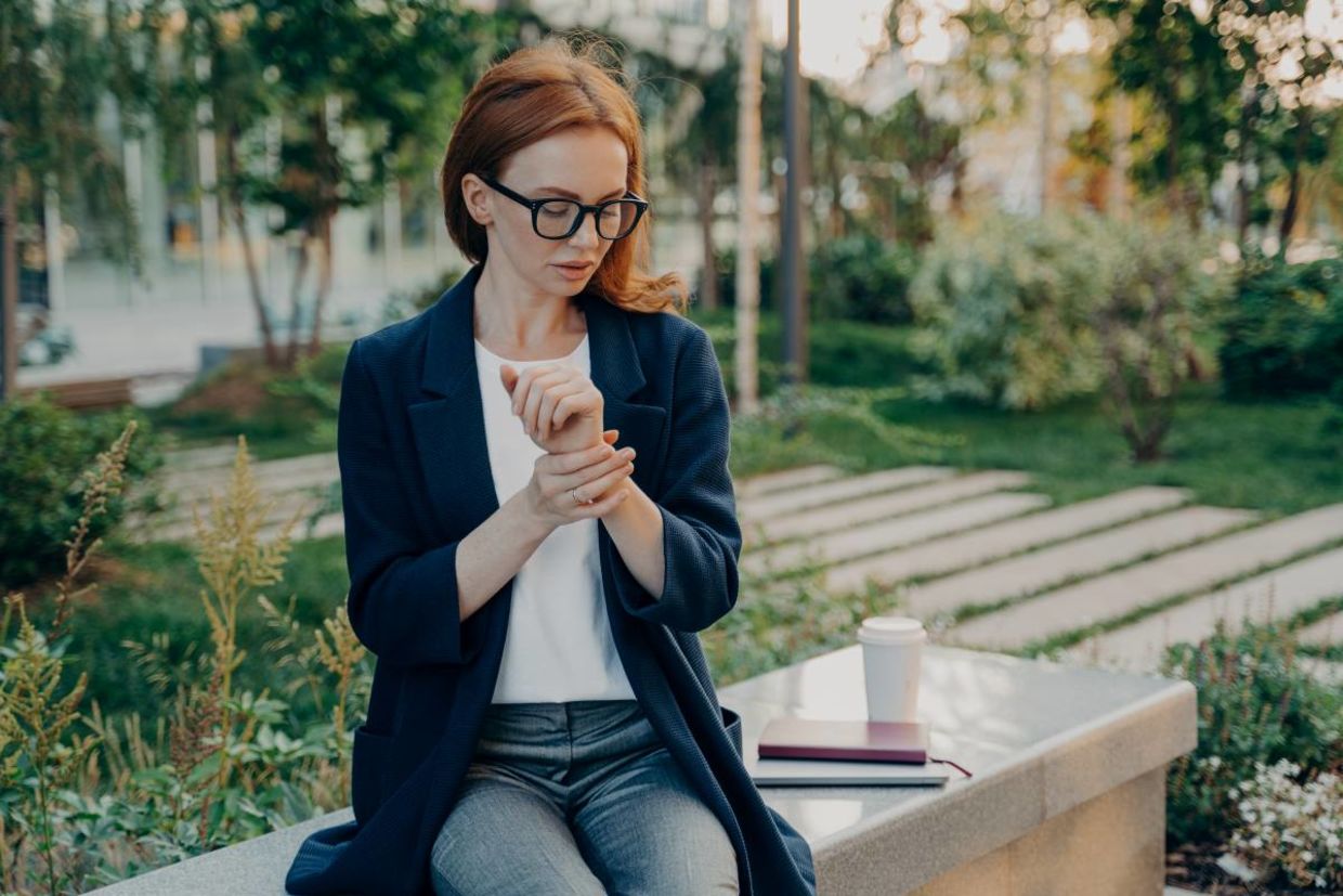 A woman checking her heart rate.