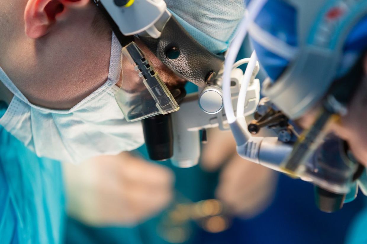 Surgeons doing a kidney transplant.