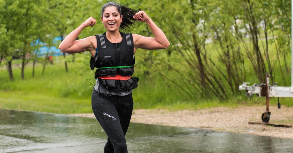 Woman walking with a weighted vest.