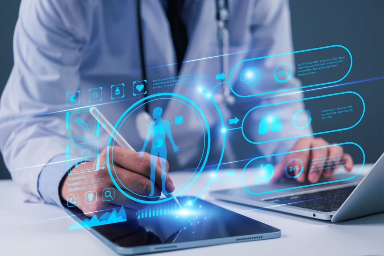 A doctor uses technology.