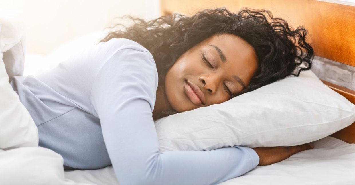 A young woman is getting restful sleep.