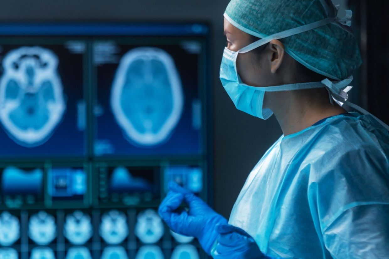 A team of medical doctors perform a surgical operation.