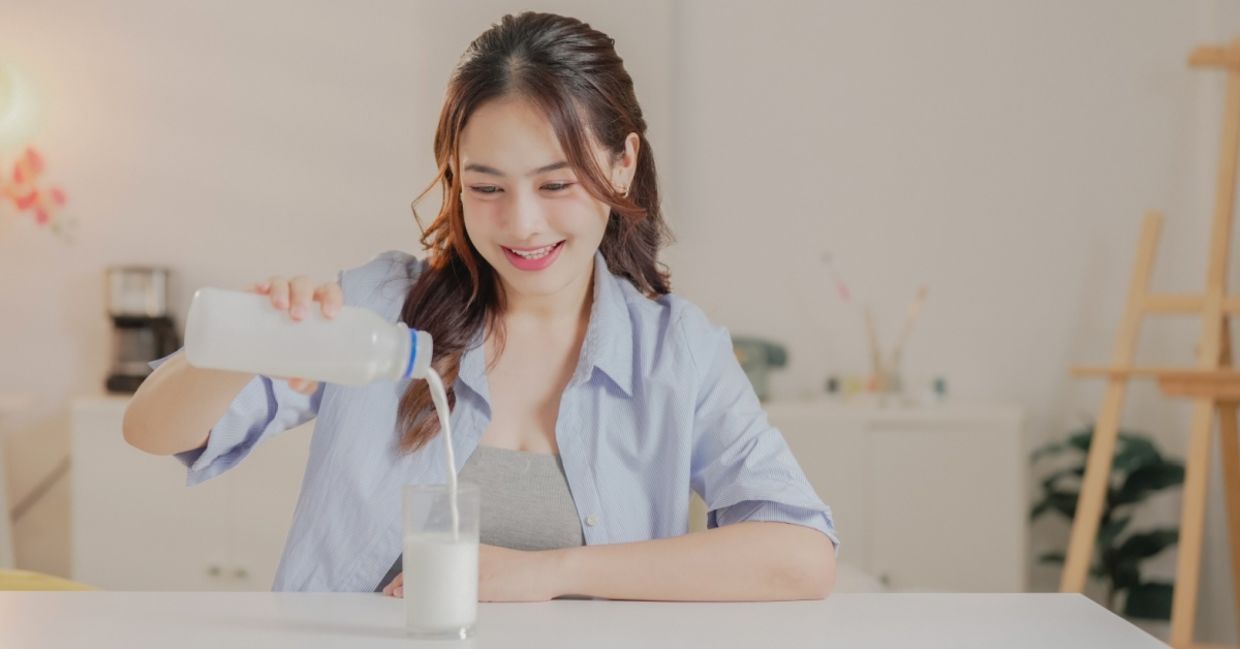 Enjoying a glass of vegan dairy-free milk.