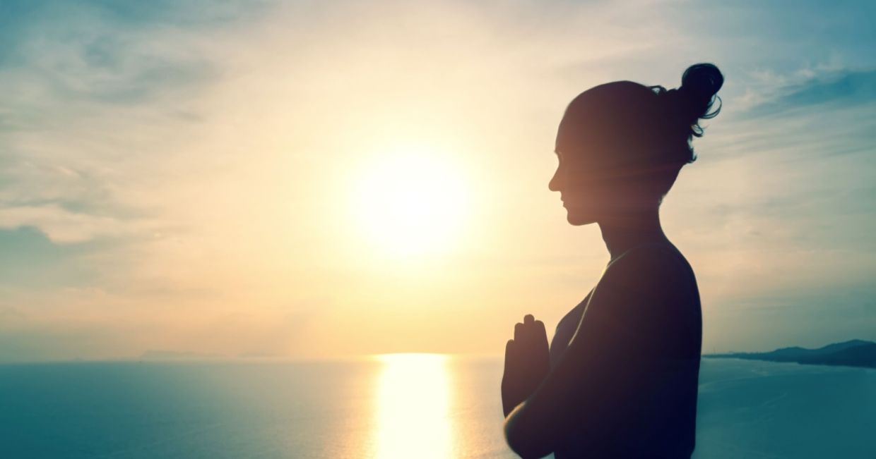 Woman meditating in nature.