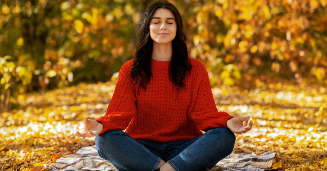 Woman meditating in nature.