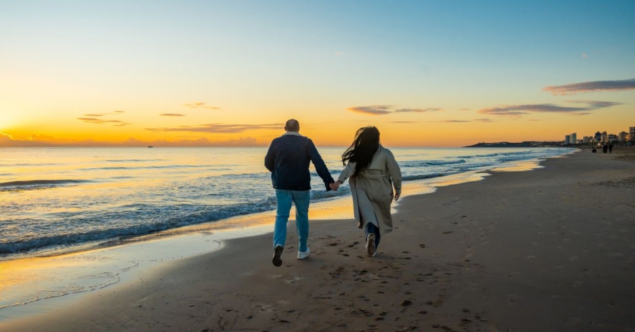 Strolling by the shore at twilight.