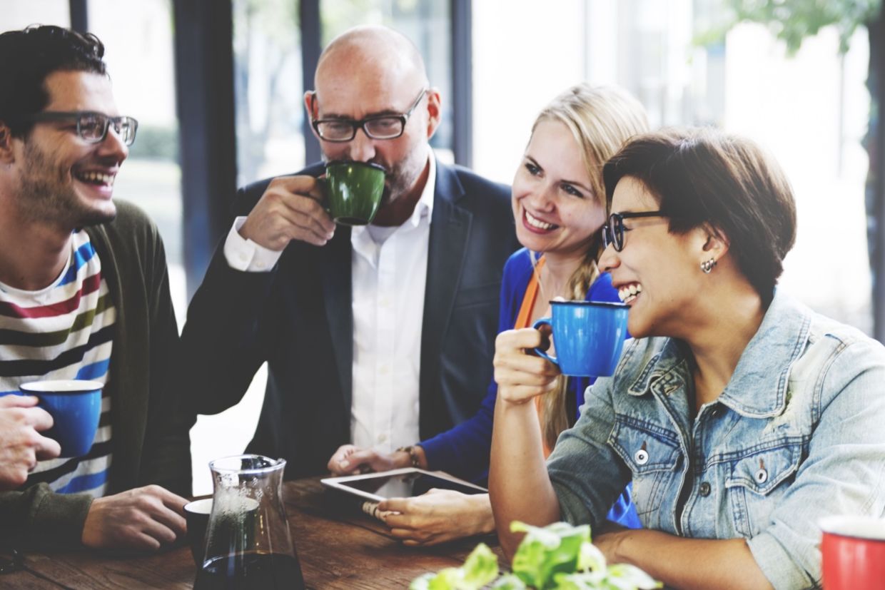 People meet together in a coffee shop.