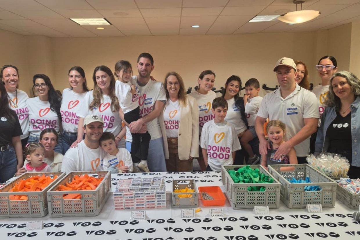 Shari Arison stands with Good Deeds Day volunteers.